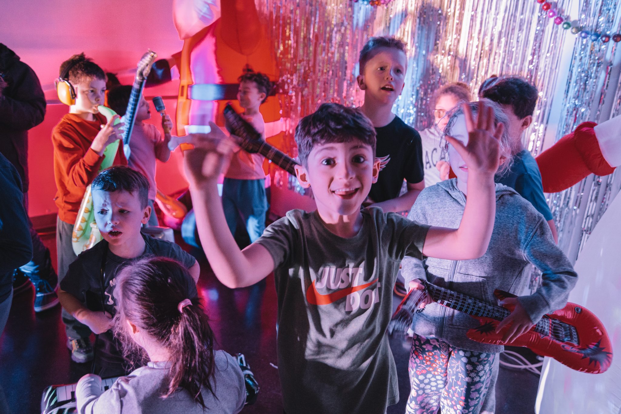 A young boy posing with muscles